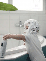 boy with cream on his head